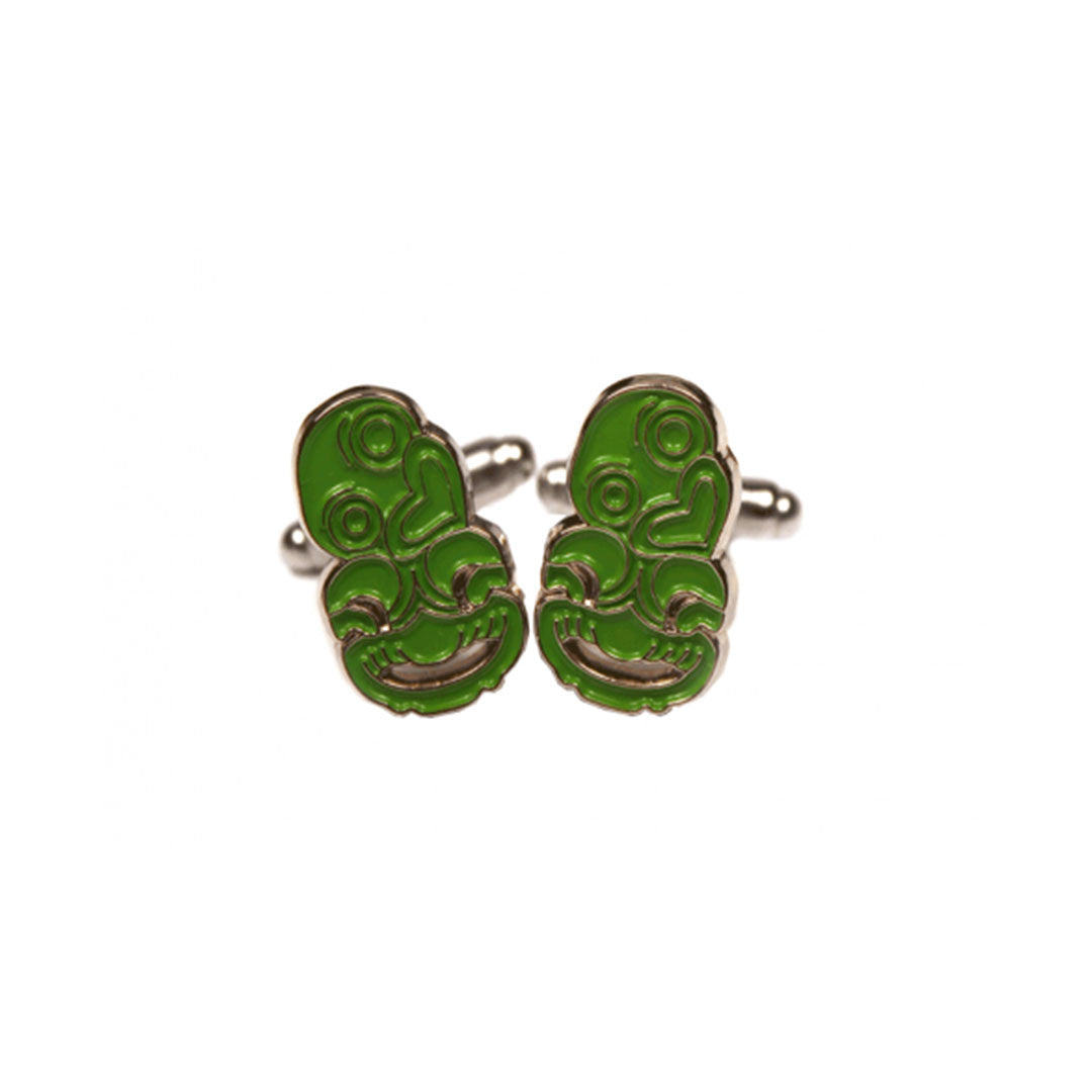Green enamel tiki cufflinks with detailed Polynesian inspired design